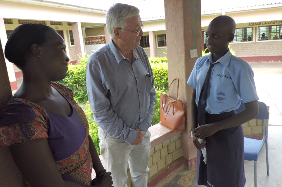 Geoffrey Fuller with his sponsor child in Uganda