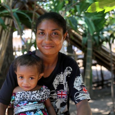Village Health Volunteer Patricia (right) helped Judy (left) get treatment when she had complications during the birth of her daughter Joylyn in Papua New Guinea.