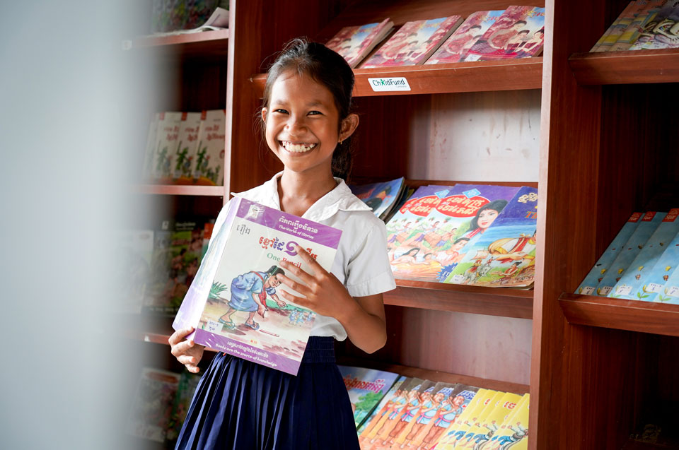 photo of Rasmei holding a book